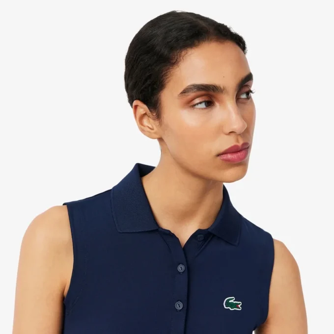 Polo de golf elástico con protección UV y corte entallado para mujer