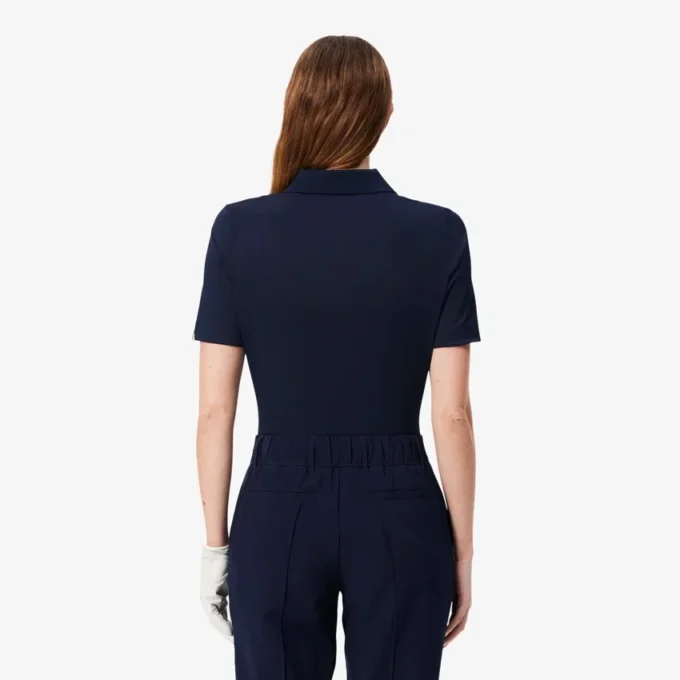 Polo de golf elástico con protección UV y corte entallado para mujer
