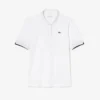 Polo de golf elástico con protección UV y corte entallado para mujer