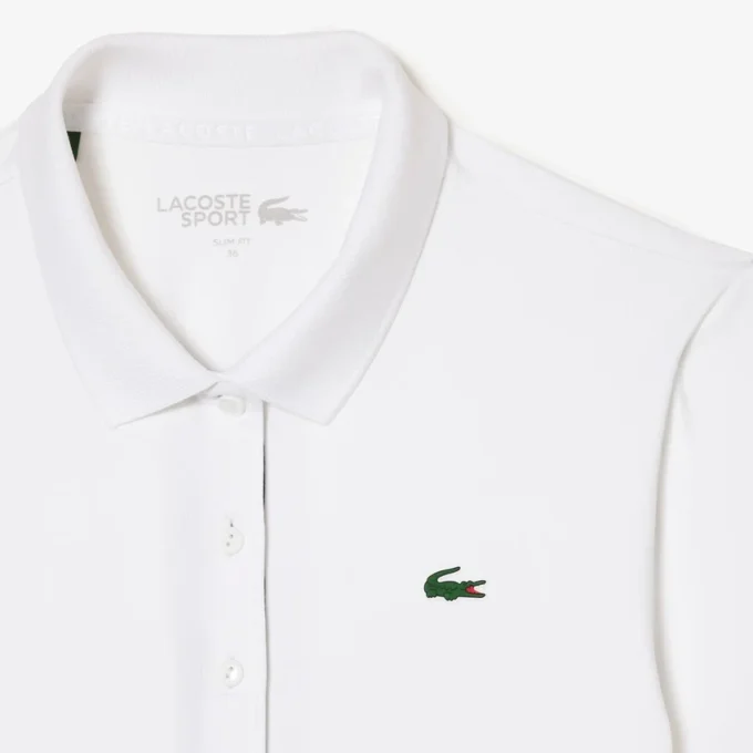 Polo de golf elástico con protección UV y corte entallado para mujer