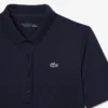 Polo de golf elástico con protección UV y corte entallado para mujer