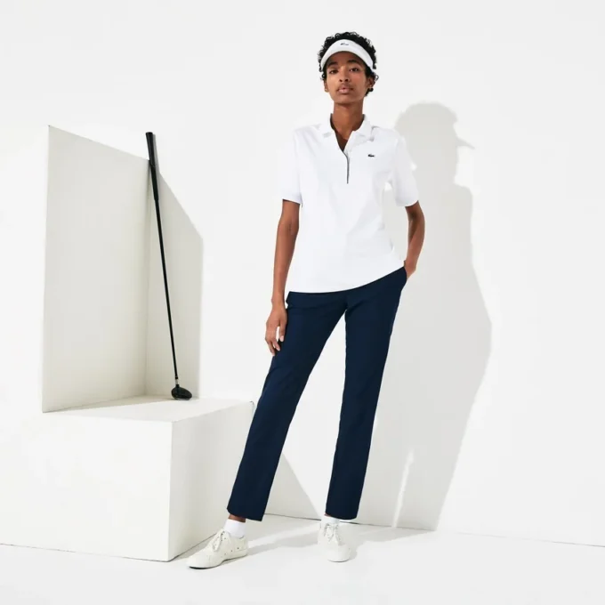Polo de golf elástico con protección UV y corte entallado para mujer