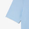 Polo de golf elástico con protección UV y corte entallado para mujer