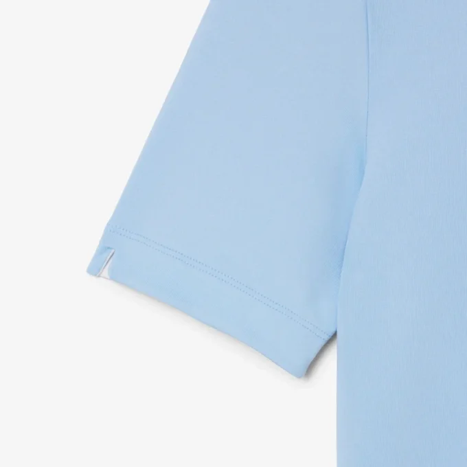 Polo de golf elástico con protección UV y corte entallado para mujer