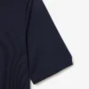 Polo de golf elástico con protección UV y corte entallado para mujer