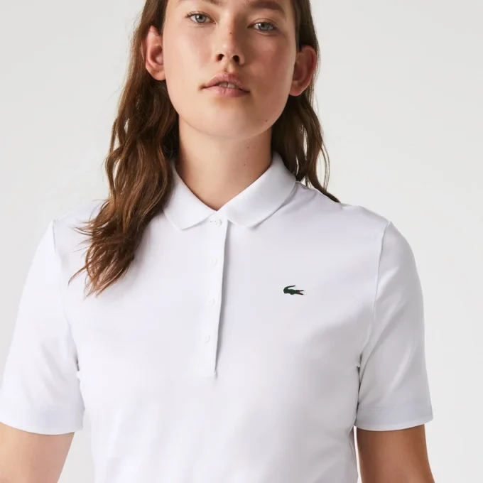 Polo de golf elástico con protección UV y corte entallado para mujer