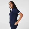 Polo de golf elástico con protección UV y corte entallado para mujer