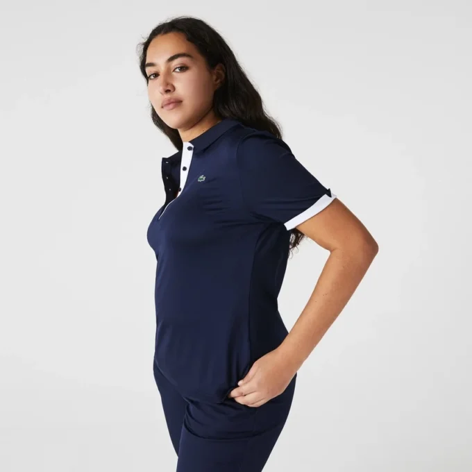 Polo de golf elástico con protección UV y corte entallado para mujer