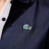 Polo de golf elástico con protección UV y corte entallado para mujer