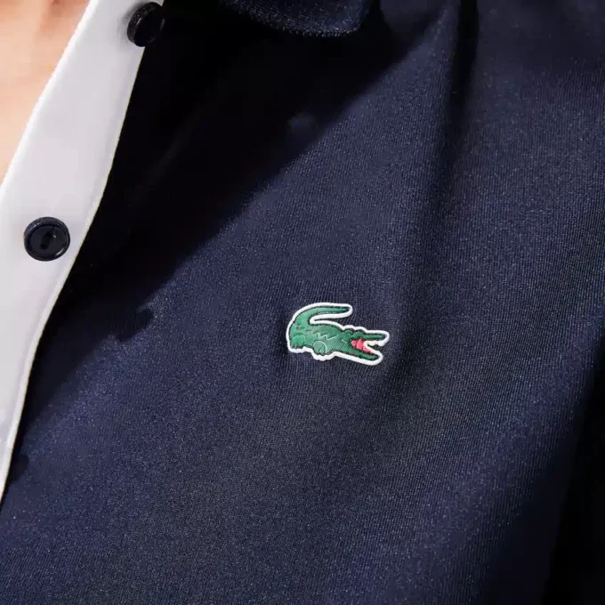 Polo de golf elástico con protección UV y corte entallado para mujer