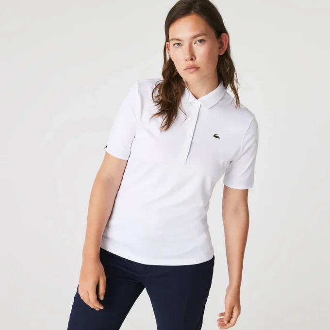 Polo de golf elástico con protección UV y corte entallado para mujer