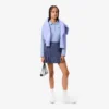 Polo de golf termorregulador con protección UV para mujer