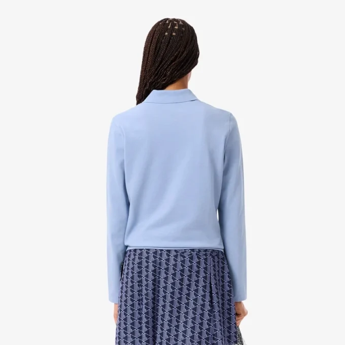 Polo de golf termorregulador con protección UV para mujer