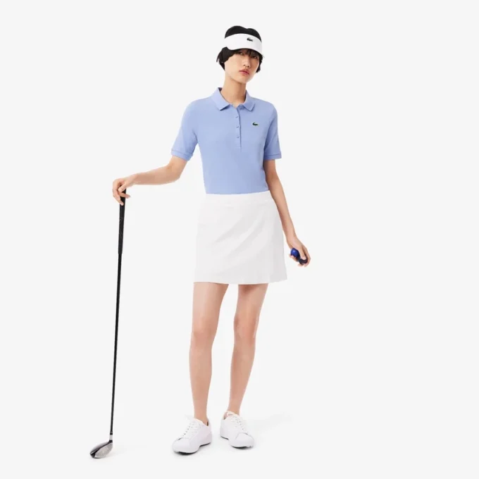Polo de golf termorregulador de corte ajustado para mujer