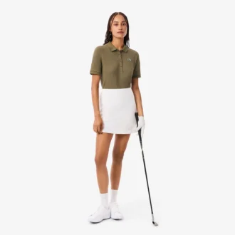 Polo de golf termorregulador de corte ajustado para mujer
