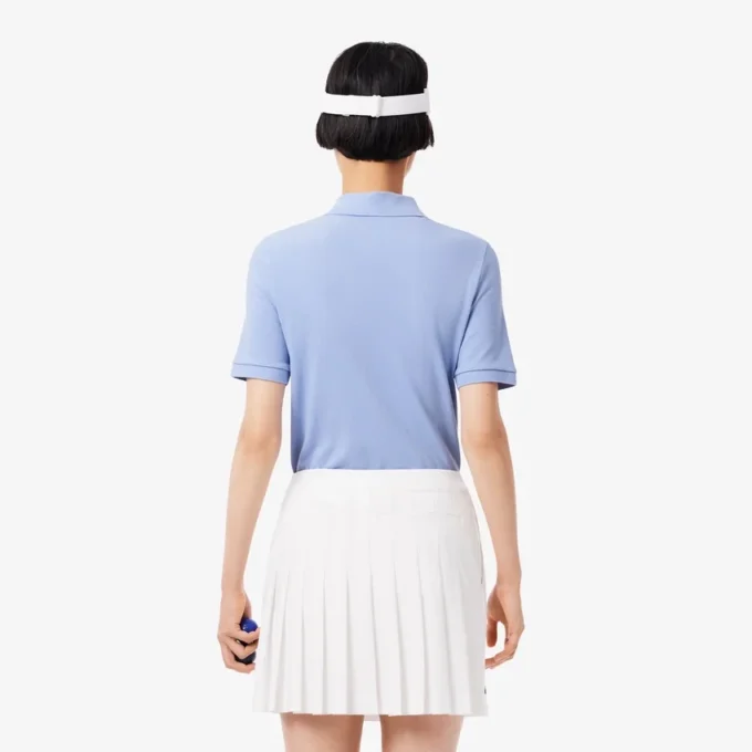 Polo de golf termorregulador de corte ajustado para mujer
