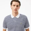 Polo de hombre L.12.12 de corte clásico con rayas y tejido Petit Piqué