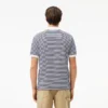 Polo de hombre L.12.12 de corte clásico con rayas y tejido Petit Piqué
