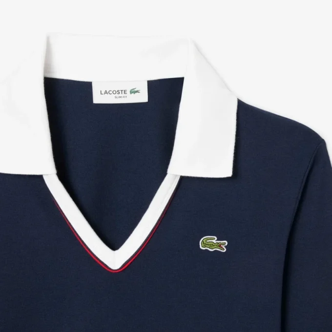 Polo de manga larga con corte entallado y detalles de ribete para mujer