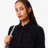 Polo de mujer de punto elástico con corte entallado