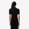 Polo de mujer de punto elástico con corte entallado
