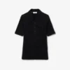 Polo de mujer de punto elástico con corte entallado