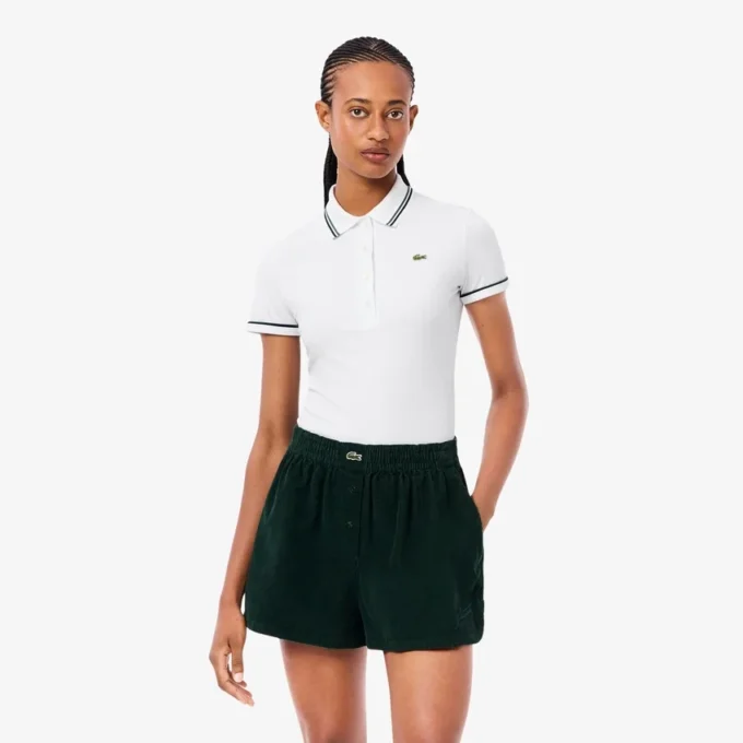 Polo de mujer L.12.D de corte entallado con detalles de ribete