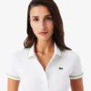 Polo de mujer L.12.D de corte entallado con detalles de ribete