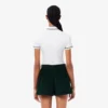 Polo de mujer L.12.D de corte entallado con detalles de ribete