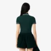 Polo de mujer L.12.D de corte entallado con detalles de ribete