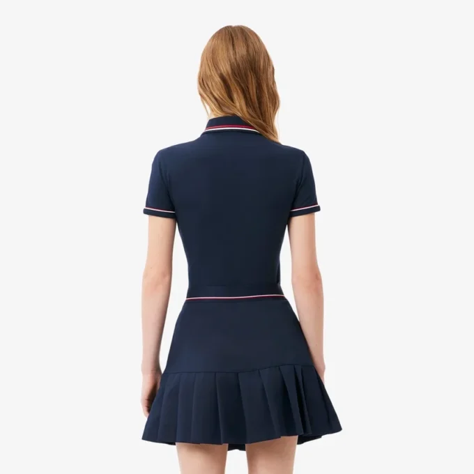 Polo de mujer L.12.D de corte entallado con detalles de ribete