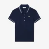 Polo de mujer L.12.D de corte entallado con detalles de ribete