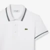 Polo de mujer L.12.D de corte entallado con detalles de ribete