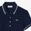 Polo de mujer L.12.D de corte entallado con detalles de ribete