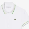 Polo de mujer L.12.D de corte entallado con detalles de ribete