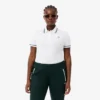 Polo de mujer L.12.D de corte entallado con detalles de ribete