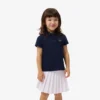 Polo de piqué con cuello festoneado para niña