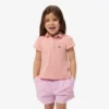 Polo de piqué con cuello festoneado para niña