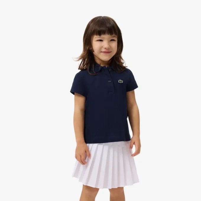 Polo de piqué con cuello festoneado para niña