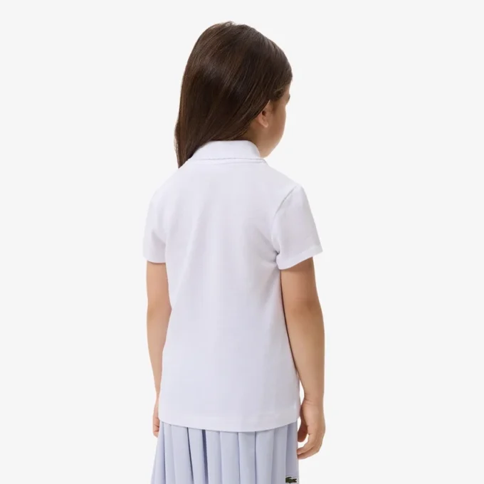 Polo de piqué con cuello festoneado para niña