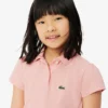 Polo de piqué con cuello festoneado para niña