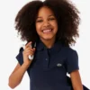 Polo de piqué con cuello festoneado para niña