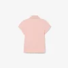 Polo de piqué con cuello festoneado para niña