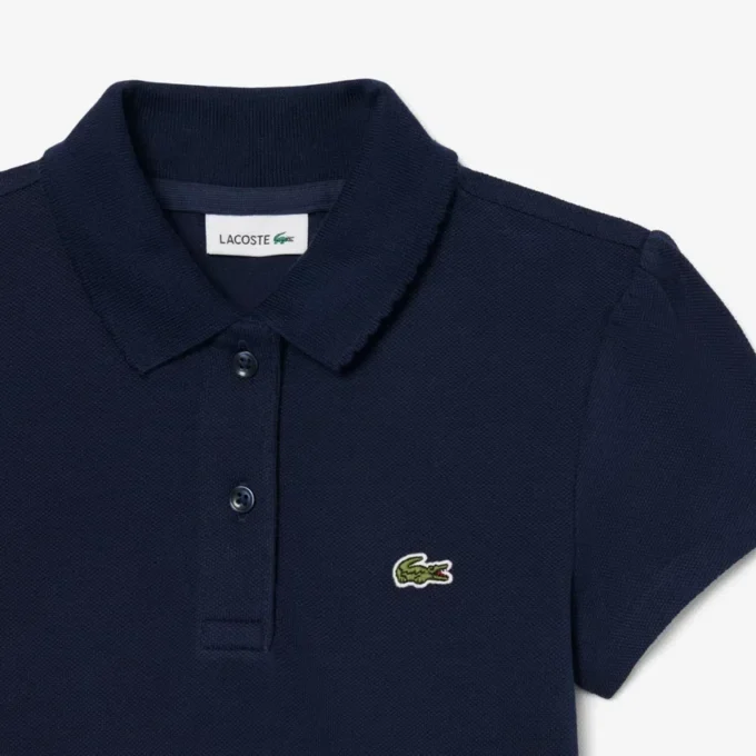 Polo de piqué con cuello festoneado para niña