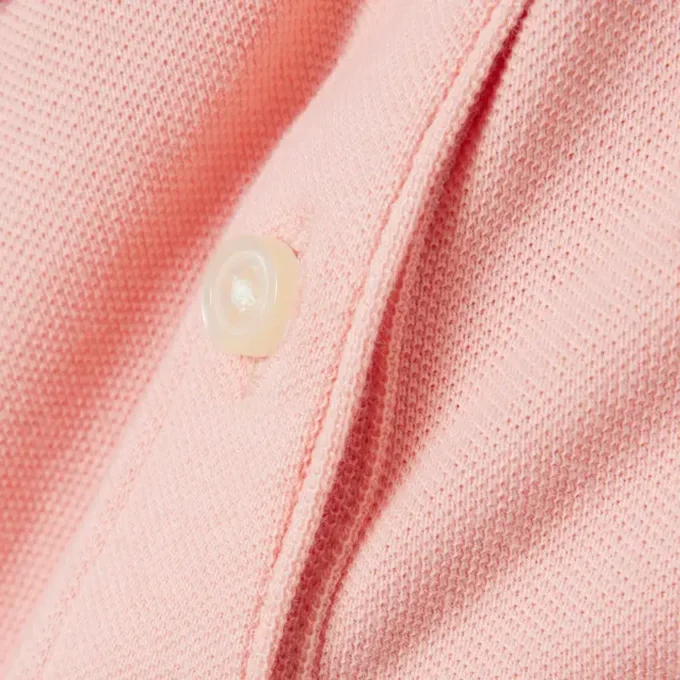 Polo de piqué con cuello festoneado para niña