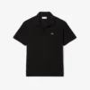 Polo de piqué de corte holgado para mujer