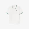 Polo de tenis con cuello a rayas y protección UV para mujer