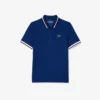 Polo de tenis con cuello a rayas y protección UV para mujer