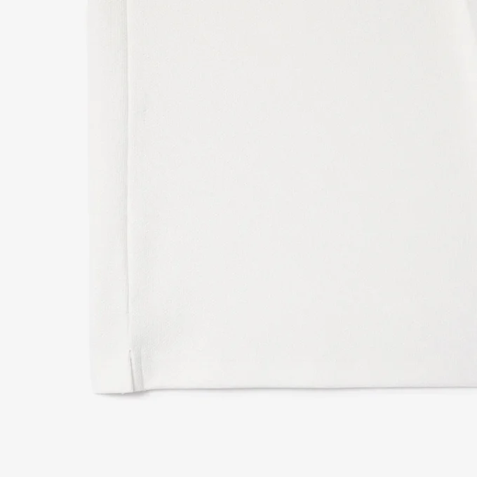 Polo de tenis con cuello a rayas y protección UV para mujer