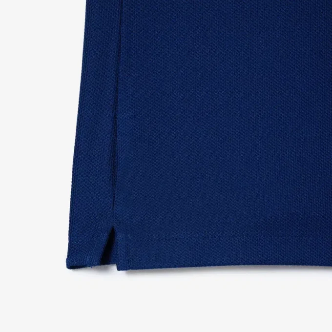Polo de tenis con cuello a rayas y protección UV para mujer